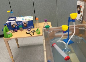 photo of pretend lab equipment in sensory table